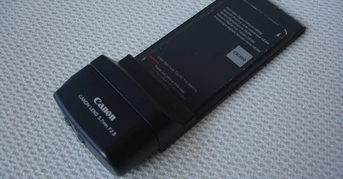 The Canon CE300 camera card, a PCMCIA card with a Canon 5.7mm F2.8 lens housing on the end, labelled for the IBM Palm Top PC 110